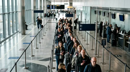 British travelers navigating European border controls at modern airport terminal