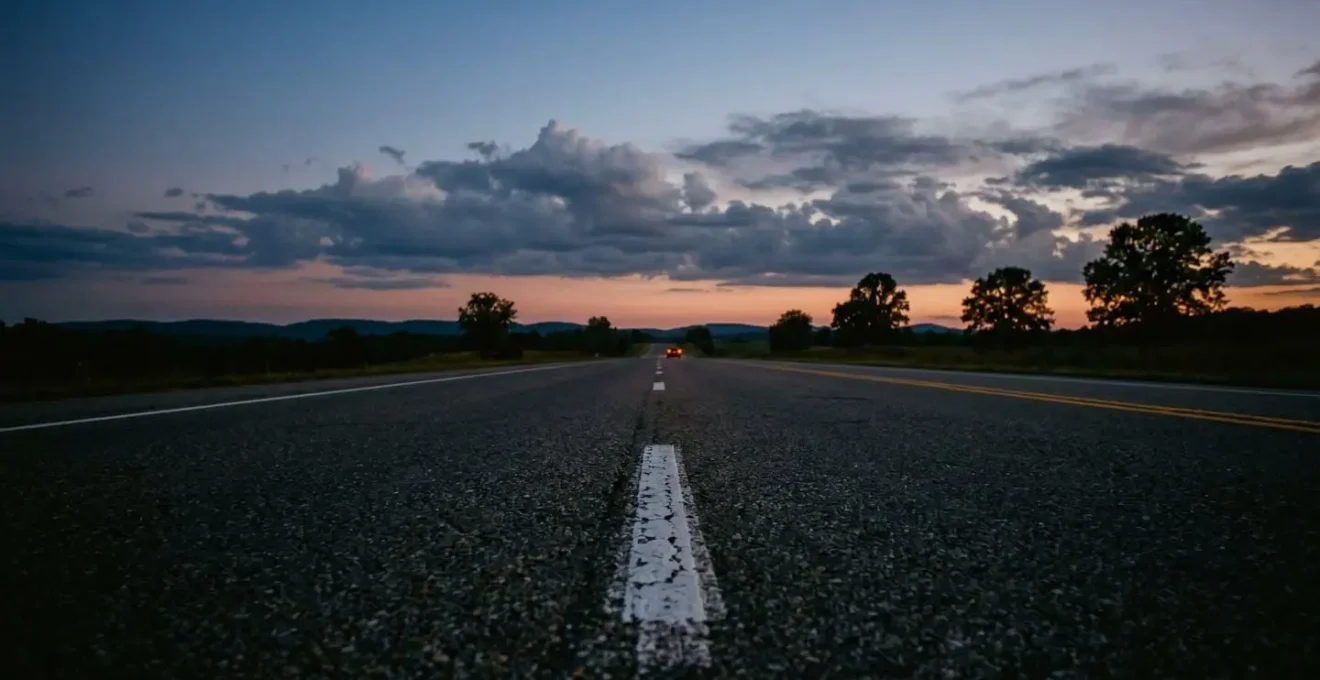 Long empty highway stretching into horizon at dusk